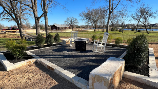 Black Paver Patio With Limestone Border Beds | Greener LawnScapes