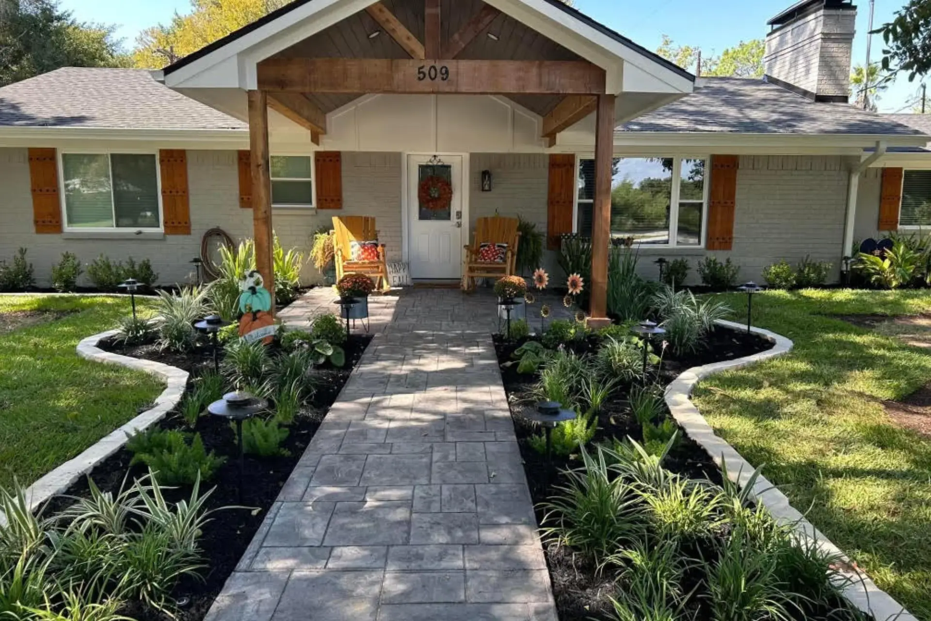 Paver patio and walkway in a Bryan College Station Texas yard designed for summer outdoor living